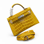 Kelly Sellier 19cm Jaune Ambre Shiny Crocodile Leather Gold Hardware & Palladium Hardware — Structured Top-Handle Handbag
