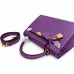 Kelly Sellier 25cm Violine Ostrich Gold Hardware Luxury Commute — Streamlined Top-Handle Handbag