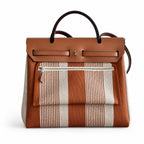 Herbag 31cm Saddle-Inspired Canvas Body with Leather Handle and Shoulder Strap — Polished Canvas-and-Leather Shoulder Style