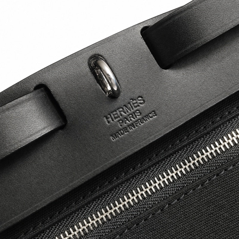 Refined Saddle-Inspired Carry Design: Herbag 31cm Saddle-Inspired Canvas Body with Leather Handle and Shoulder Strap