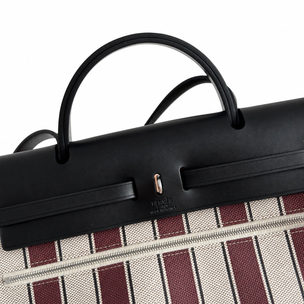 Saddle-Influenced Canvas Hand-Carry Style: Herbag 31cm Saddle-Inspired Canvas Body with Leather Handle and Shoulder Strap