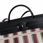 Saddle-Influenced Canvas Hand-Carry Style: Herbag 31cm Saddle-Inspired Canvas Body with Leather Handle and Shoulder Strap