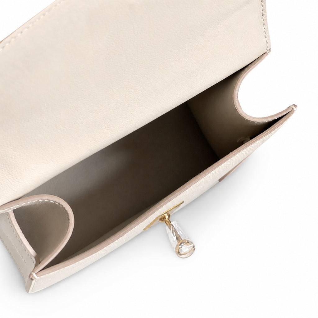 Kelly Double-Sided Epsom Leather in Milkshake White with Gold Buckle — Refined Reversible Carry Design