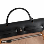 Refined Canvas Body with Leather Details: Herbag 31cm Saddle-Inspired Canvas Body with Leather Handle and Shoulder Strap