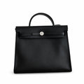 Herbag 31cm Saddle-Inspired Canvas Body with Leather Handle and Shoulder Strap — Elegant Leather-Accented Canvas Bag