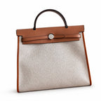 Canvas Body and Leather Trim Design: Herbag 31cm Saddle-Inspired Canvas Body with Leather Handle and Shoulder Strap