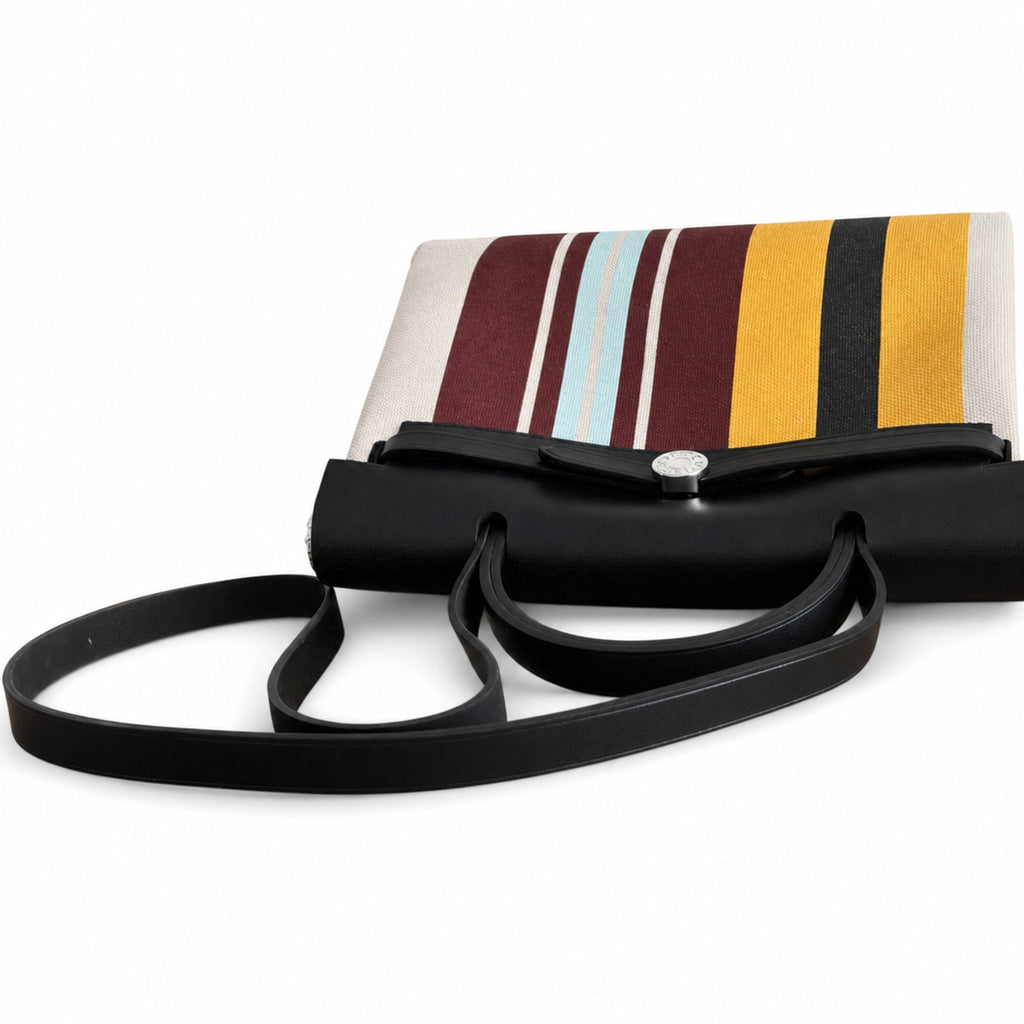 Saddle-Influenced Canvas Hand-Carry Style: Herbag 31cm Saddle-Inspired Canvas Body with Leather Handle and Shoulder Strap