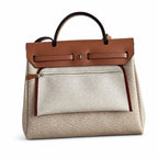 Structured Leather-Trimmed Canvas Carryall: Herbag 31cm Saddle-Inspired Canvas Body with Leather Handle and Shoulder Strap