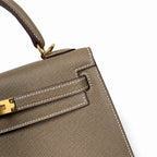 Classic Hand-Carry Silhouette: Kelly 25 Elephant Gray Epsom Gold Buckle, fully handmade with wax thread