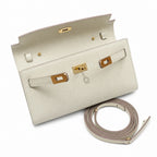 Kelly to go Color: ck10/Craie Size: 19*11.5*1.5cm Leather: Epsom Hardware: Gold Kelly crossbody bag, Milkshake White, cowhide, Gold Buckle, handmade — Compact Pochette Clutch