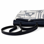 Distinctive Leather-Trimmed Canvas Design: Herbag 31cm Saddle-Inspired Canvas Body with Leather Handle and Shoulder Strap
