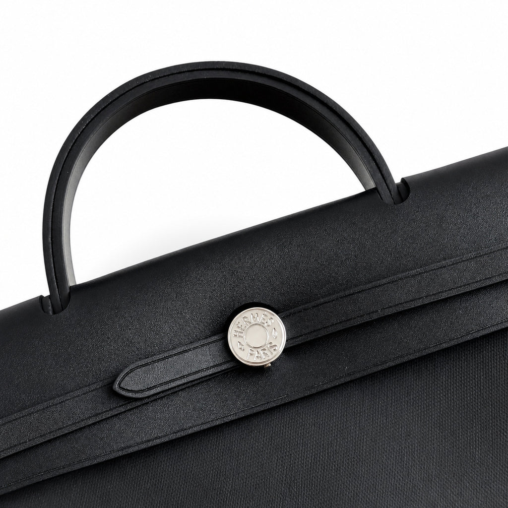 Herbag 31cm Saddle-Inspired Canvas Body with Leather Handle and Shoulder Strap — Elegant Leather-Accented Canvas Bag