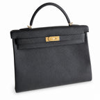 Kelly in Black Togo Leather with Gold Buckle Handmade — Structured Top-Handle Handbag