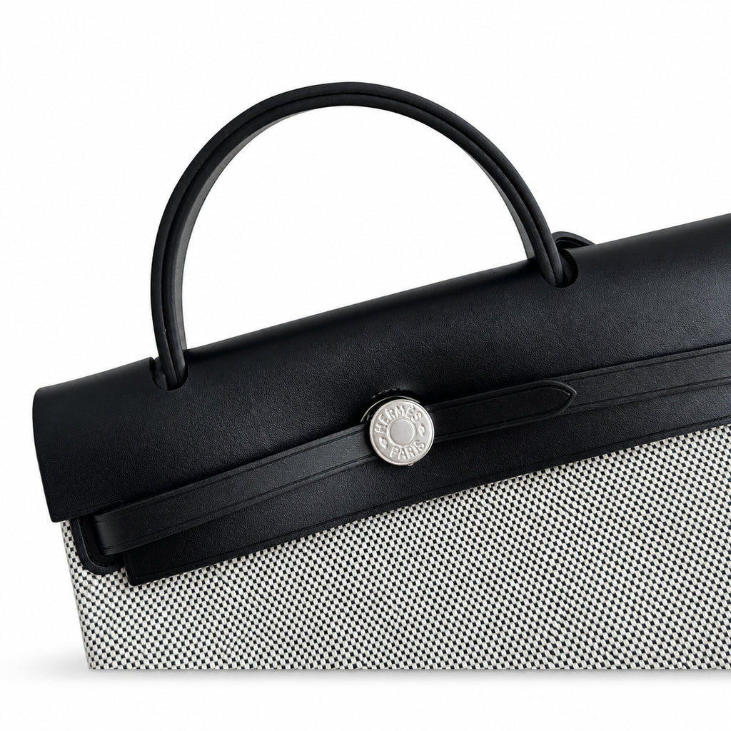 Herbag 31cm Saddle-Inspired Canvas Body with Leather Handle and Shoulder Strap — Elegant Canvas-and-Leather Bag