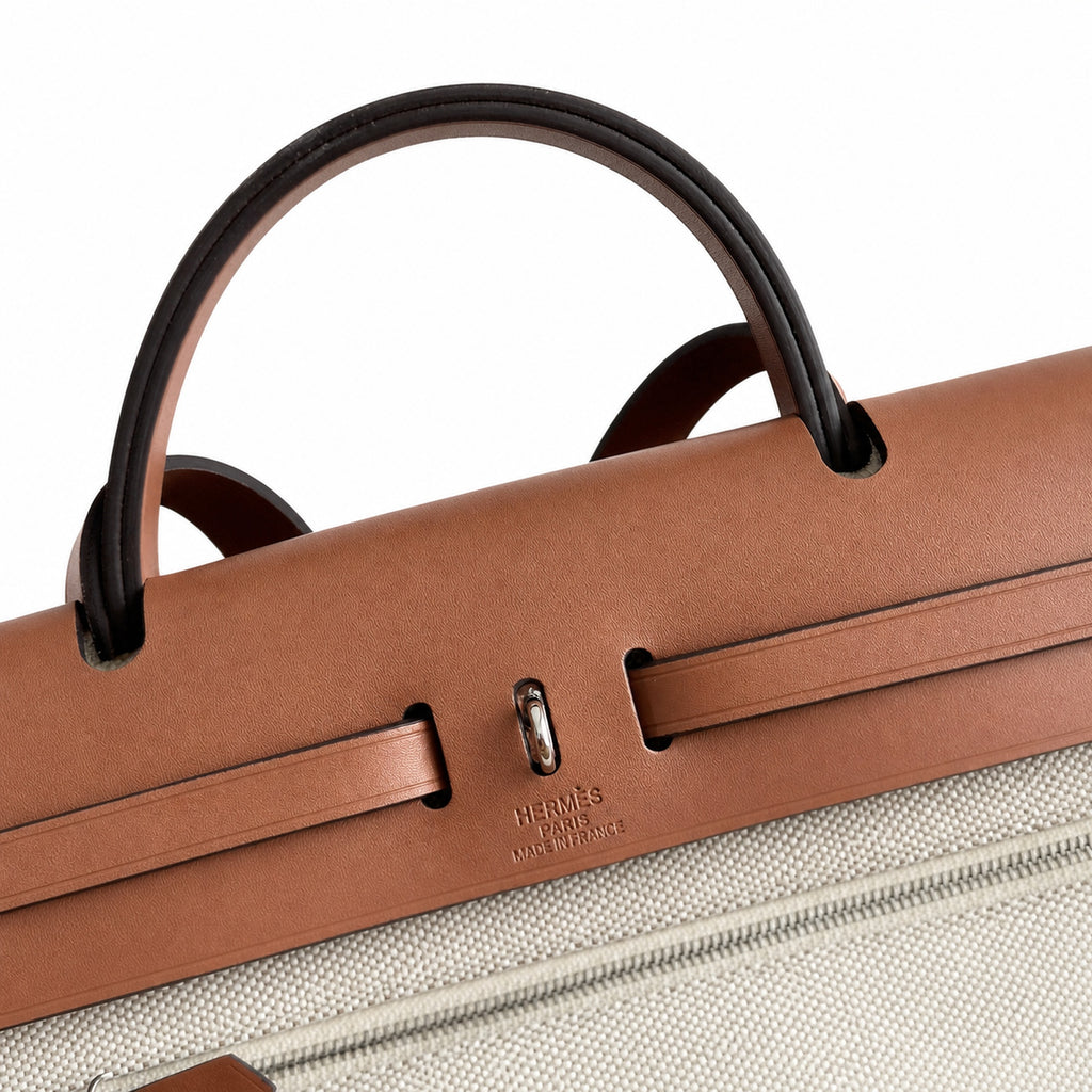 Canvas Body and Leather Trim Design: Herbag 31cm Saddle-Inspired Canvas Body with Leather Handle and Shoulder Strap