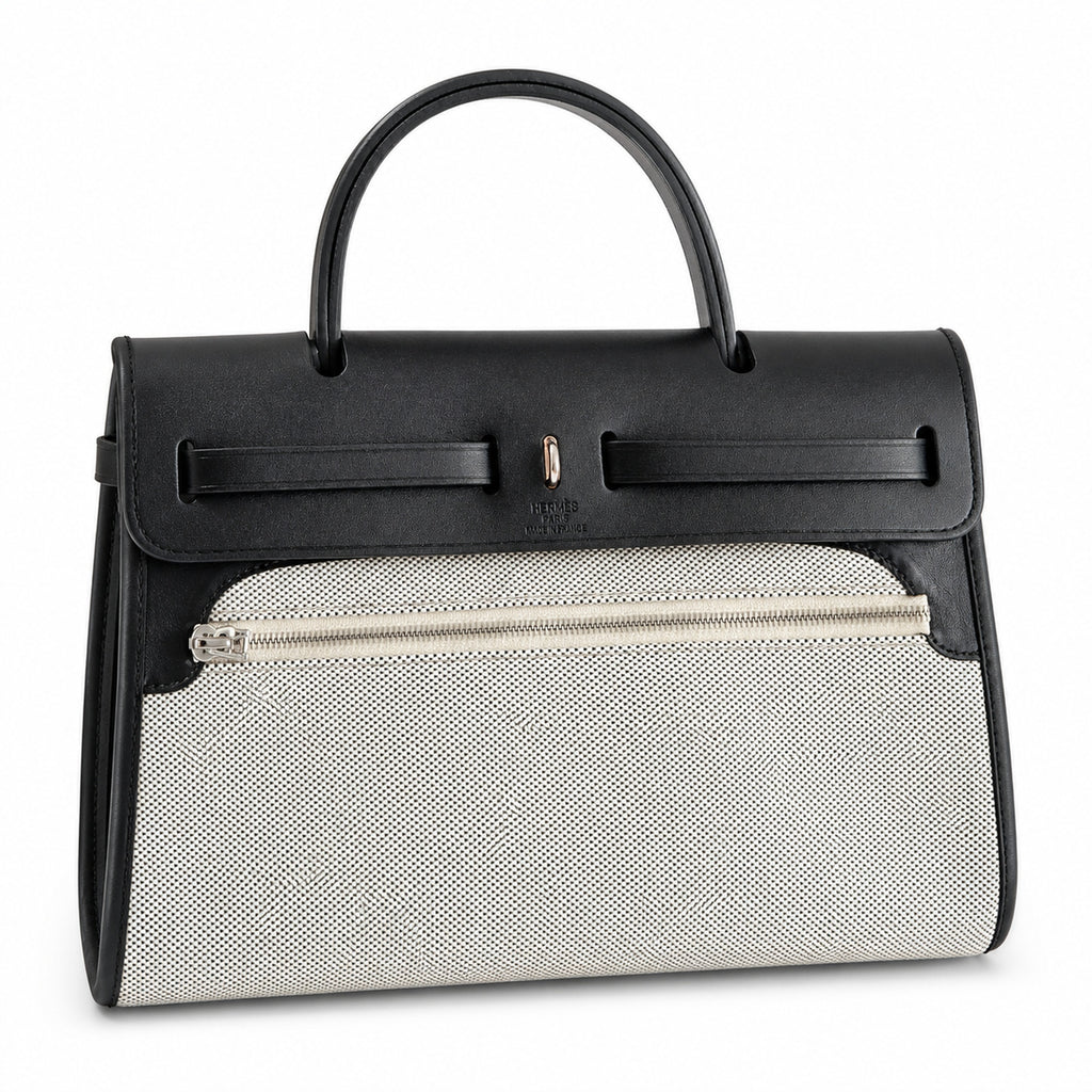 Herbag 31cm Saddle-Inspired Canvas Body with Leather Handle and Shoulder Strap — Elegant Leather-Accented Canvas Bag