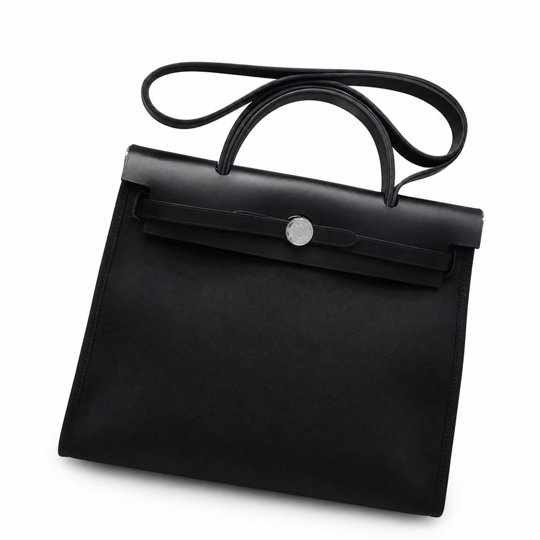 Refined Saddle-Inspired Carry Design: Herbag 31cm Saddle-Inspired Canvas Body with Leather Handle and Shoulder Strap