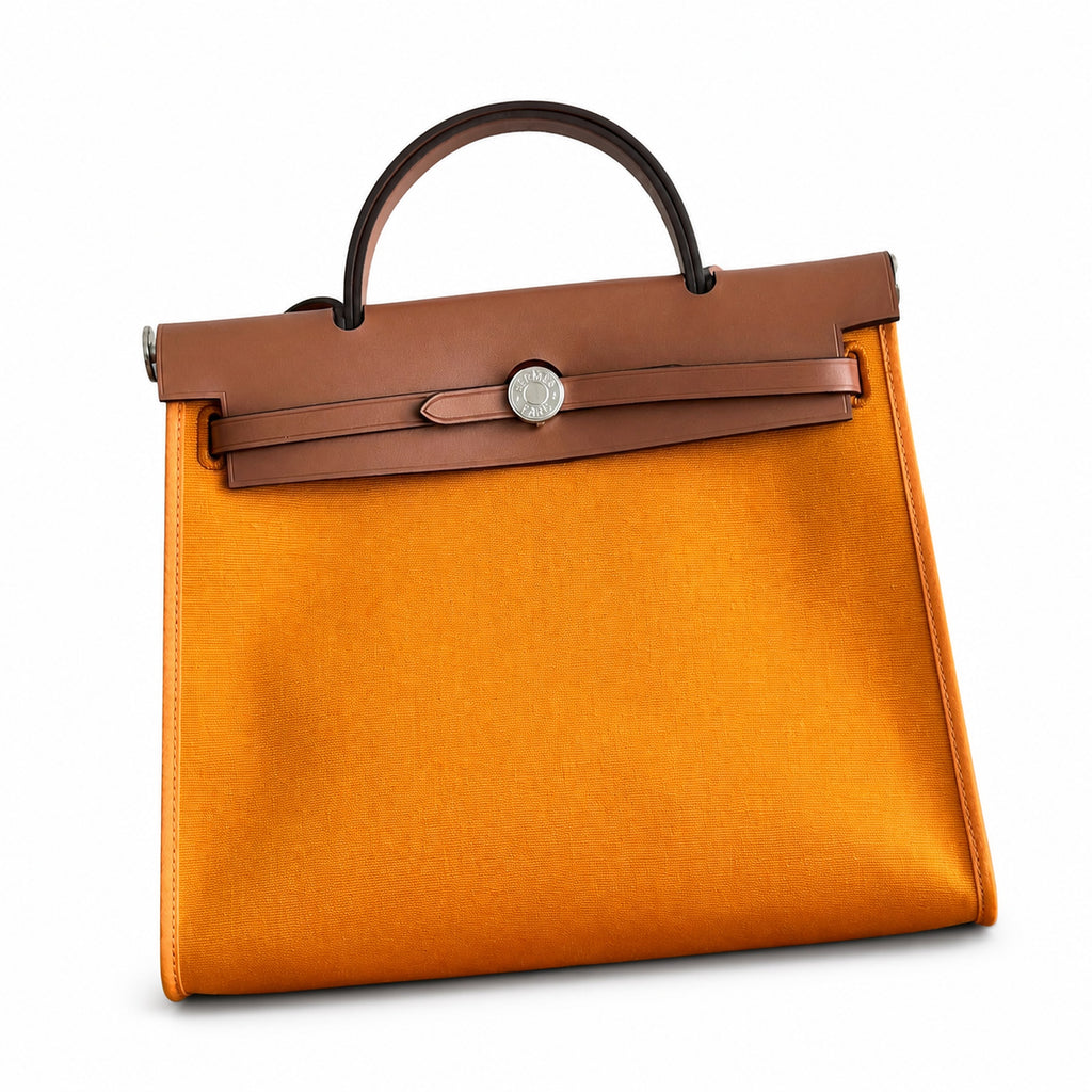 Polished Canvas-and-Leather Handbag: Herbag 31cm Saddle-Inspired Canvas Body with Leather Handle and Shoulder Strap