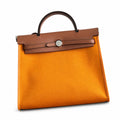 Polished Canvas-and-Leather Handbag: Herbag 31cm Saddle-Inspired Canvas Body with Leather Handle and Shoulder Strap