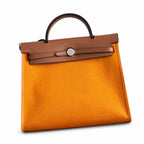 Polished Canvas-and-Leather Handbag: Herbag 31cm Saddle-Inspired Canvas Body with Leather Handle and Shoulder Strap