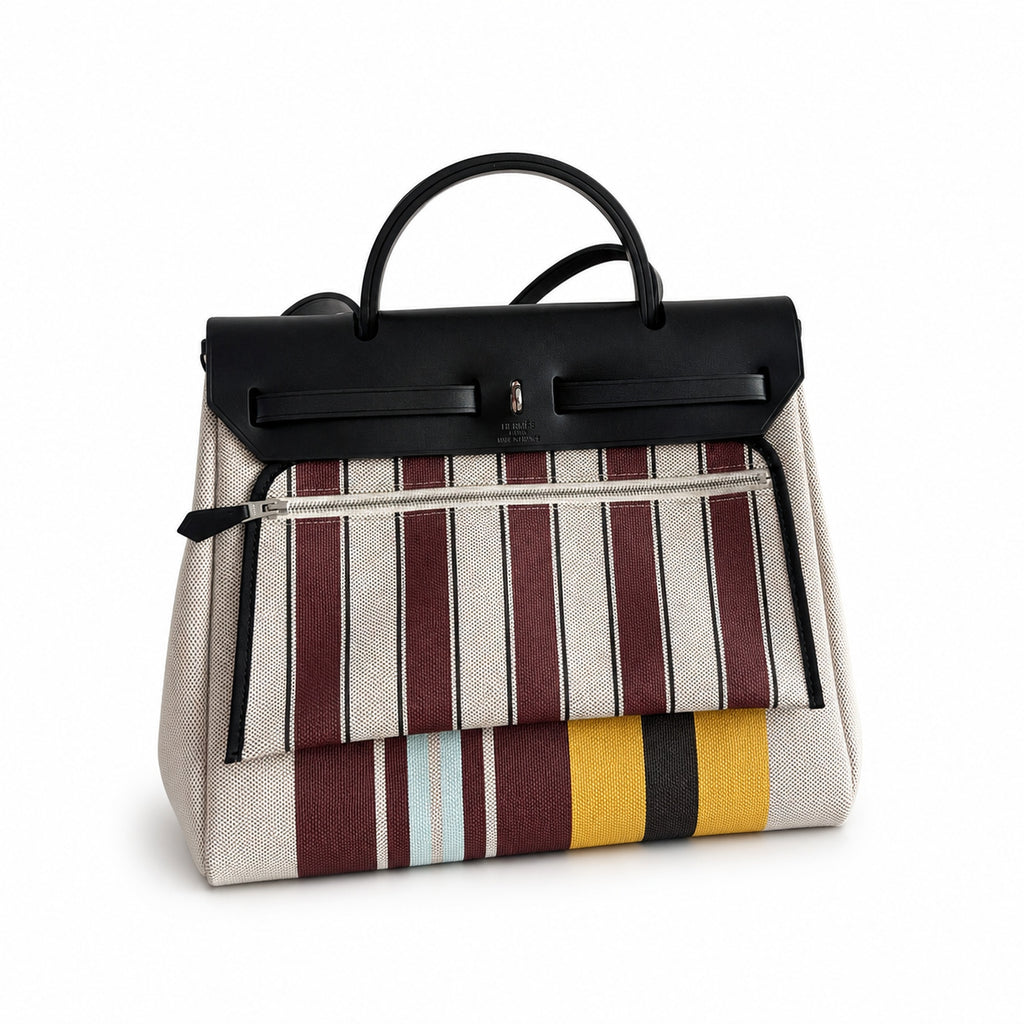Saddle-Influenced Canvas Hand-Carry Style: Herbag 31cm Saddle-Inspired Canvas Body with Leather Handle and Shoulder Strap