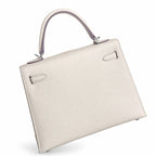 Milkshake White, Gold Buckle and Silver Buckle, Kelly 25, imported Epsom — Polished Structured Handbag