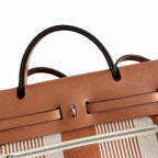 Herbag 31cm Saddle-Inspired Canvas Body with Leather Handle and Shoulder Strap — Polished Canvas-and-Leather Shoulder Style