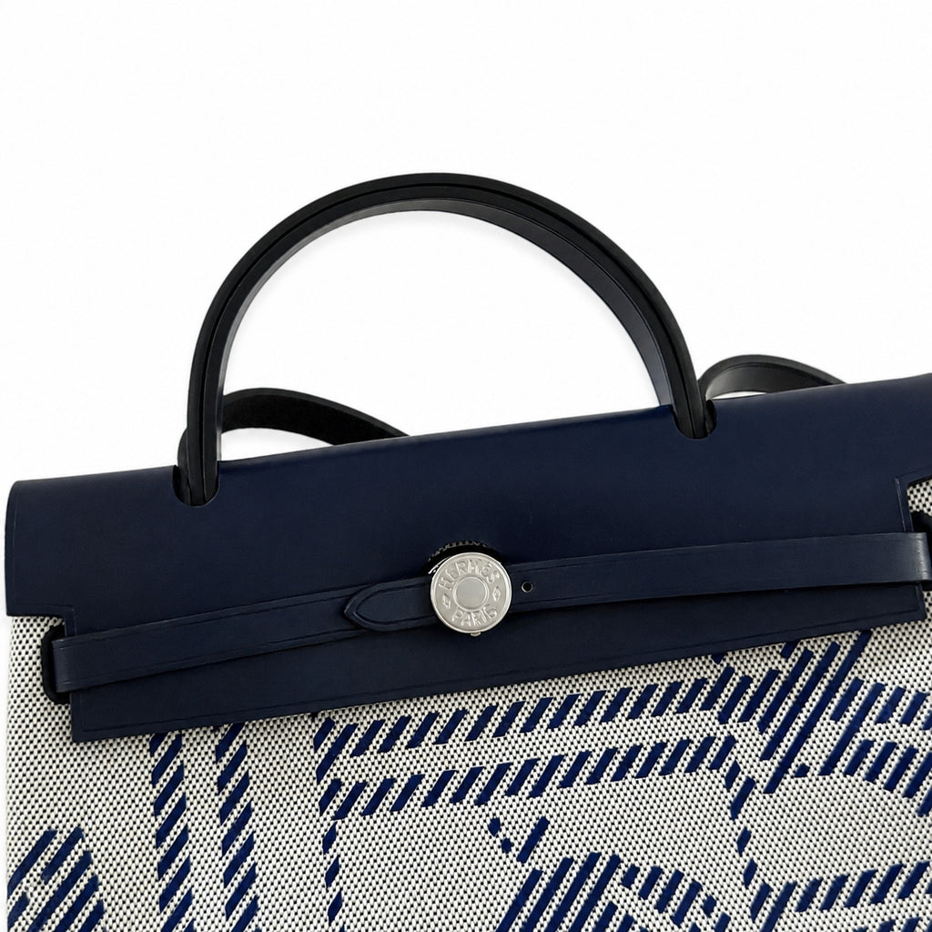 Distinctive Leather-Trimmed Canvas Design: Herbag 31cm Saddle-Inspired Canvas Body with Leather Handle and Shoulder Strap