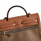 Herbag 31cm Saddle-Inspired Canvas Body with Leather Handle and Shoulder Strap — Structured Leather-Trimmed Canvas Carryall