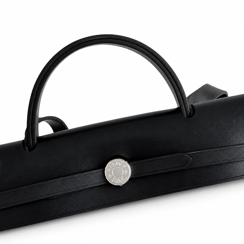 Refined Canvas Body with Leather Details: Herbag 31cm Saddle-Inspired Canvas Body with Leather Handle and Shoulder Strap