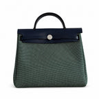 Herbag 31cm Saddle-Inspired Canvas Body with Leather Handle and Shoulder Strap — Elegant Canvas-and-Leather Hand-Carry Bag