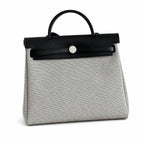 Herbag 31cm Saddle-Inspired Canvas Body with Leather Handle and Shoulder Strap — Elegant Canvas-and-Leather Bag