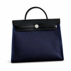 Canvas-and-Leather Top-Handle Style: Herbag 31cm Saddle-Inspired Canvas Body with Leather Handle and Shoulder Strap