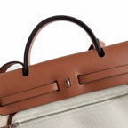 Structured Leather-Trimmed Canvas Carryall: Herbag 31cm Saddle-Inspired Canvas Body with Leather Handle and Shoulder Strap