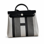 Polished Saddle-Inspired Carryall: Herbag 31cm Saddle-Inspired Canvas Body with Leather Handle and Shoulder Strap