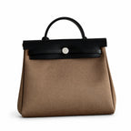 Refined Canvas Body with Leather Details: Herbag 31cm Saddle-Inspired Canvas Body with Leather Handle and Shoulder Strap