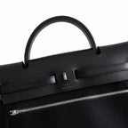 Sophisticated Canvas Carryall: Herbag 31cm Saddle-Inspired Canvas Body with Leather Handle and Shoulder Strap