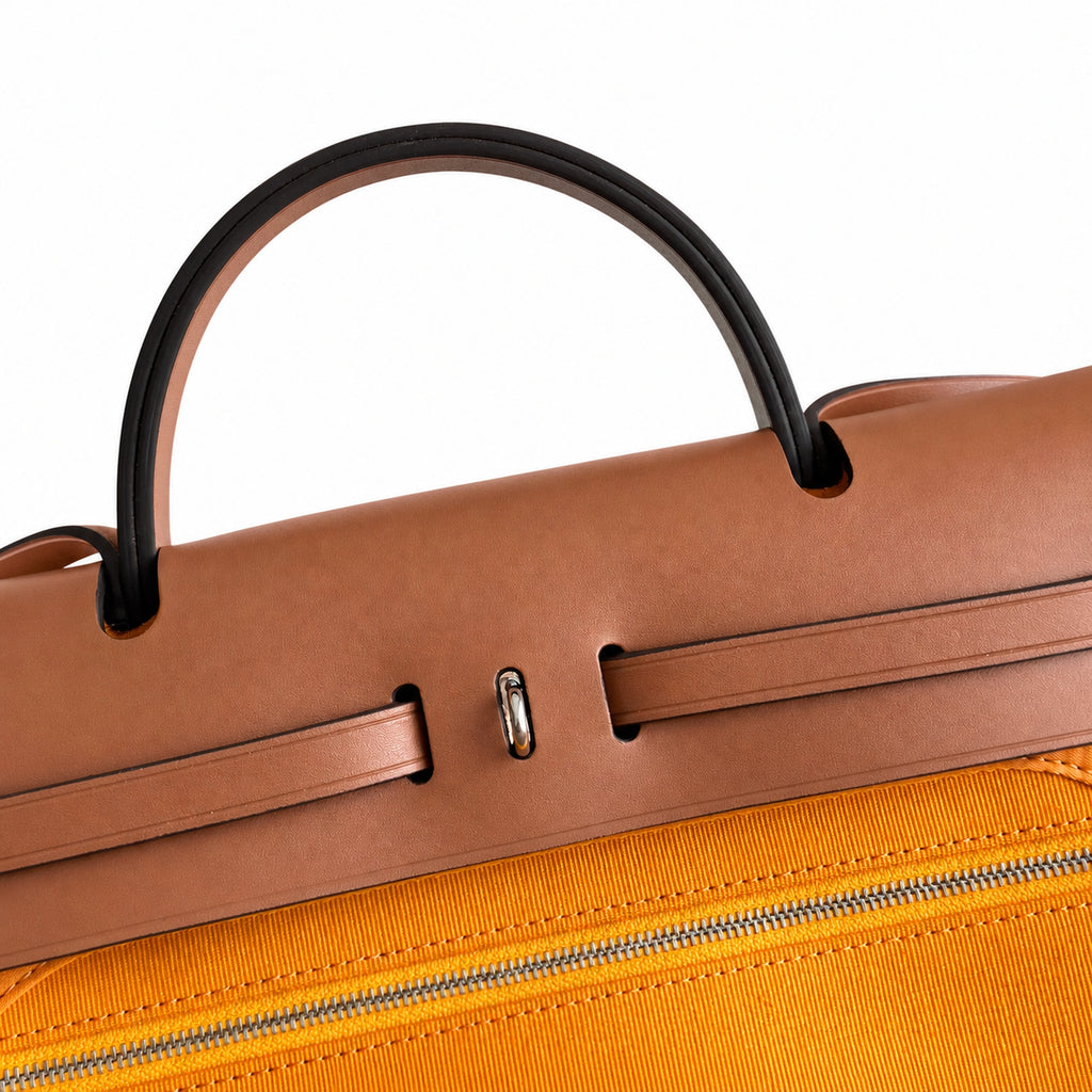 Polished Canvas-and-Leather Handbag: Herbag 31cm Saddle-Inspired Canvas Body with Leather Handle and Shoulder Strap