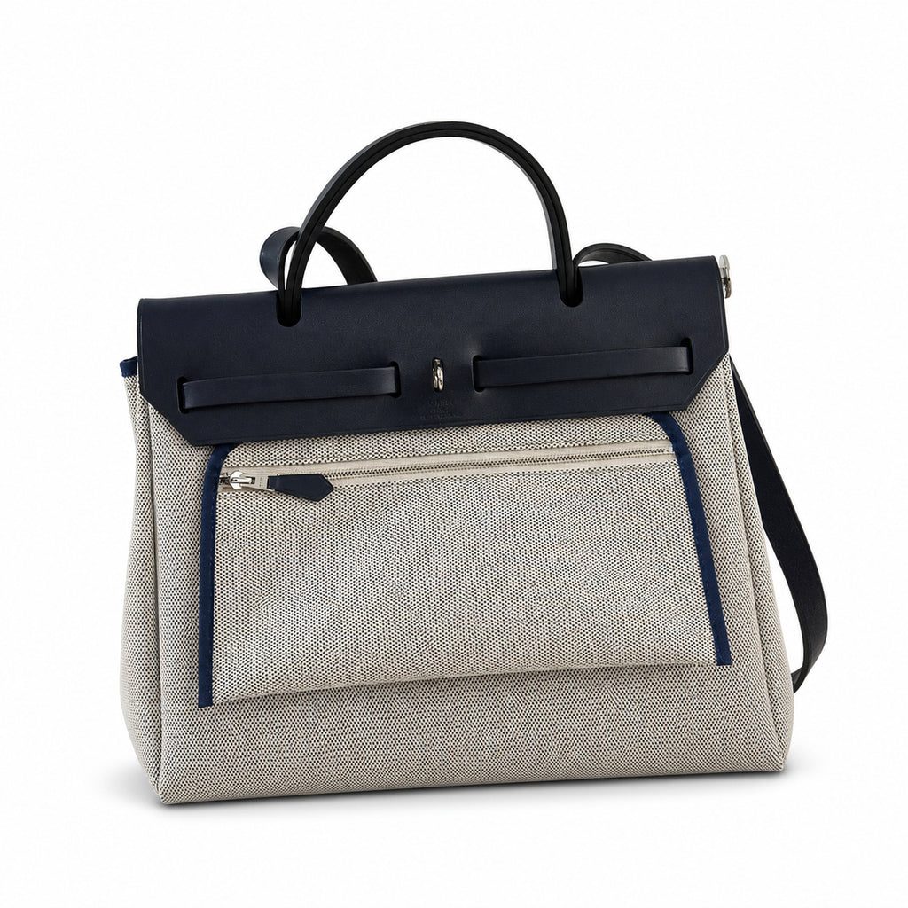Distinctive Leather-Trimmed Canvas Design: Herbag 31cm Saddle-Inspired Canvas Body with Leather Handle and Shoulder Strap