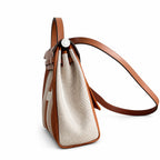 Herbag 31cm Saddle-Inspired Canvas Body with Leather Handle and Shoulder Strap — Polished Canvas-and-Leather Shoulder Style