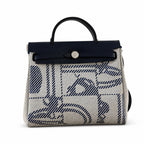 Distinctive Leather-Trimmed Canvas Design: Herbag 31cm Saddle-Inspired Canvas Body with Leather Handle and Shoulder Strap