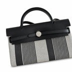 Polished Saddle-Inspired Carryall: Herbag 31cm Saddle-Inspired Canvas Body with Leather Handle and Shoulder Strap